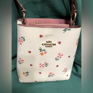 Coach Small Bucket Bag with Heart Petal Print.